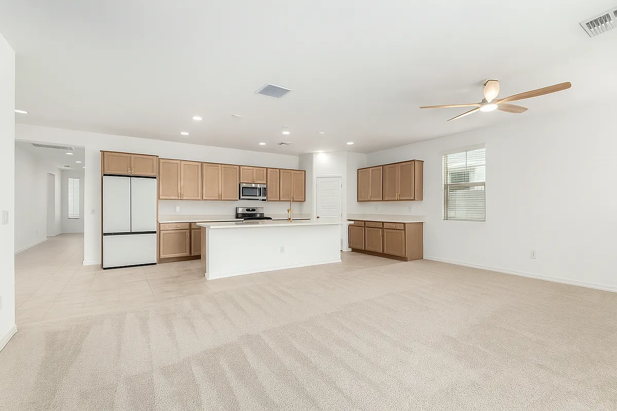 Photo 1 of 20 - 10223 W Piccadilly Rd - Avondale, AZ Kitchen, living room, and entrance hallway - 10223 W Piccadilly Rd