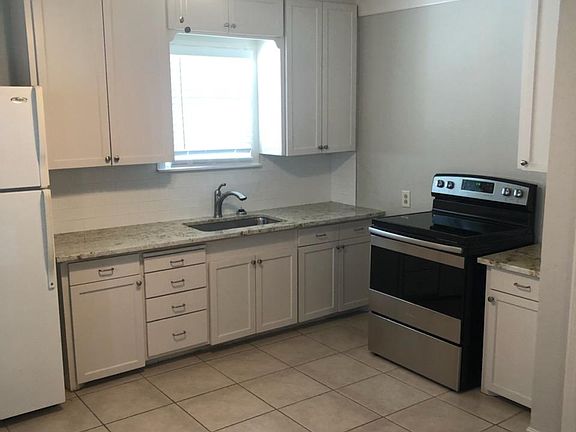 Brand new oven/stove, microwave, newly installed granite countertops, open layout to living area, etc.