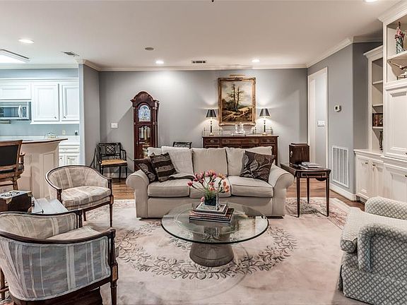 The open concept living space provides opportunities for entertaining. The built in shelves and cabinet provides lots of display space the storage.