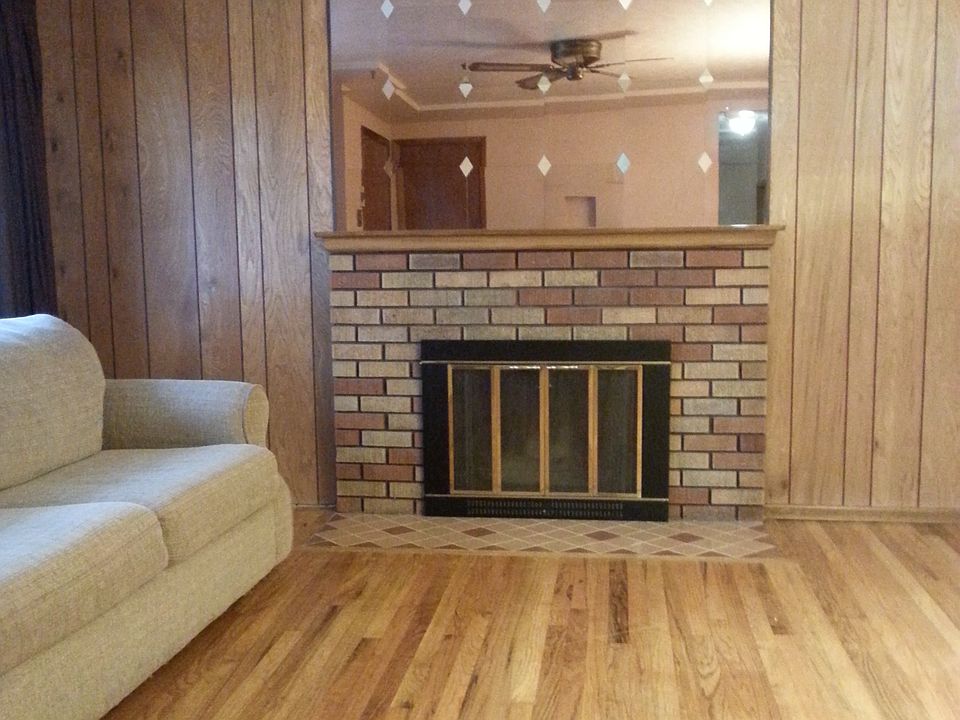 Large living room with non-working fireplace