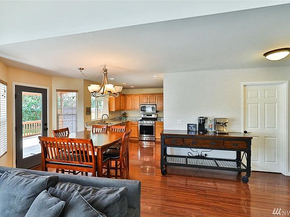 Open concept great room overlooks private backyard. 