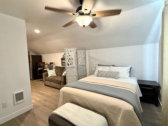 Queen size bed, night stand and somewhere to sit while you put on your socks or kick off your shoes