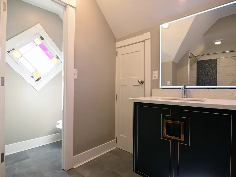 Separate "throne room" with ornate refurbished stand glass windows with restored original hardware.