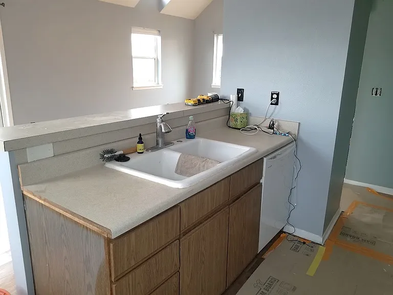 Kitchen with breakfast bar seating.