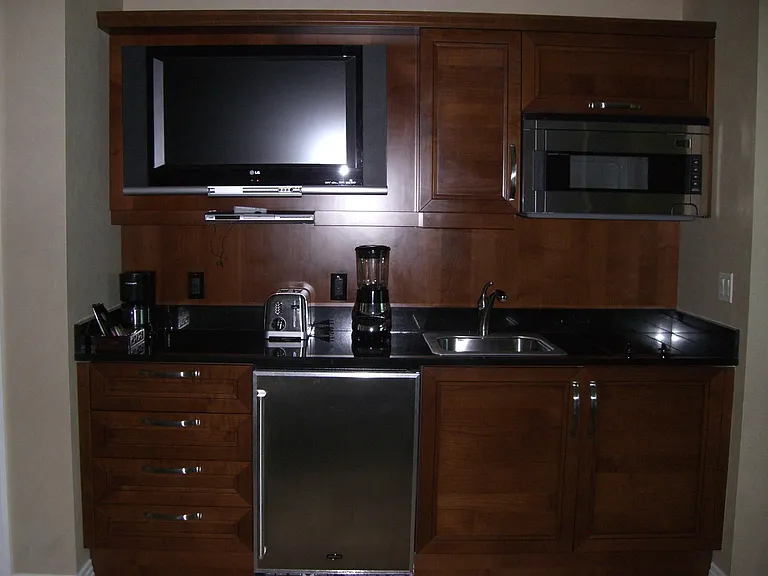 Kitchenette w/Lg. TV; Microwave; 2-Burner Stovetop; Undercounter Refrigerator (sm. Freezer); Sink; Appliances to include Toaster/Blender/Coffee Maker