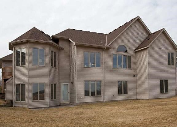 The entire exterior is maintenance free. The large amount of windows allows great views of the wildlife area and drenches the home in natural sunlight.