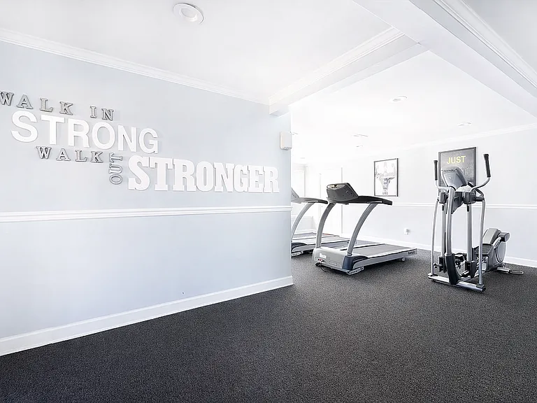 Modern fitness room with motivational decor
