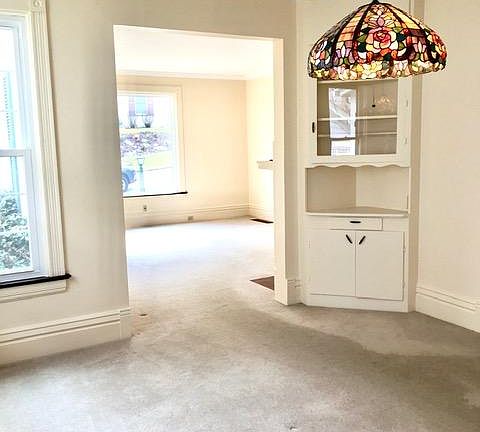 View from kitchen through to Dining Room 12 X 9 (with built-in corner cabinet) through to Living Room