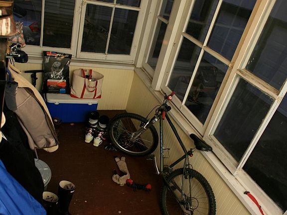 Screened-in back porch overlooking backyard