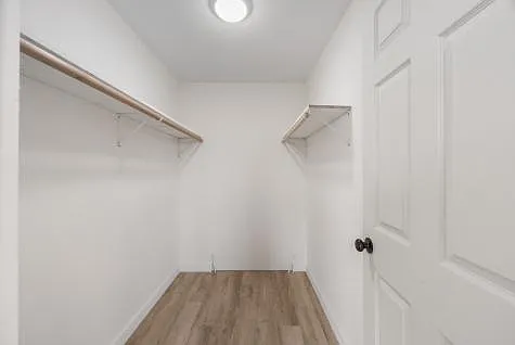 Spacious, bright Master bedroom with large walk-in closet, ensuite bath with large vanity and walk-in shower, easy to clean vinyl plank flooring, HWBB heat