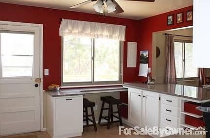 Kitchen 2
						:
						Breakfast bar looks out on park, and hidden trash/recycling pullout drawer.