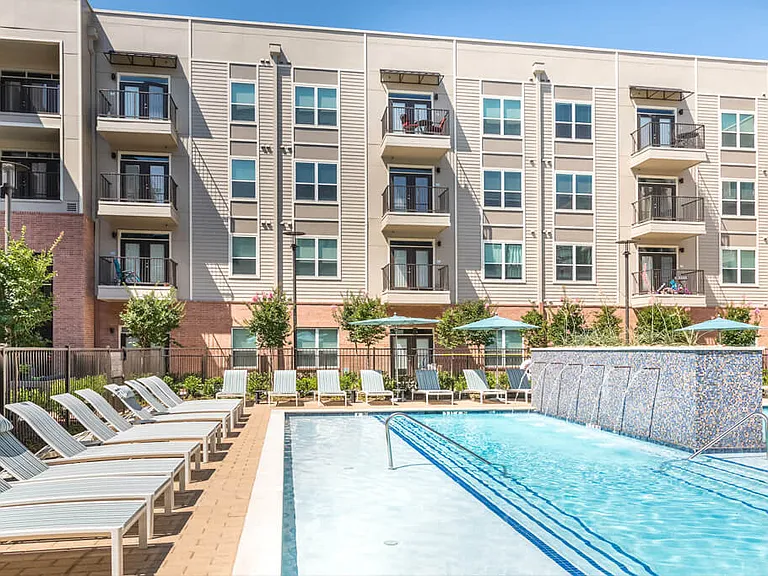 Elegant fountain pouring into pool