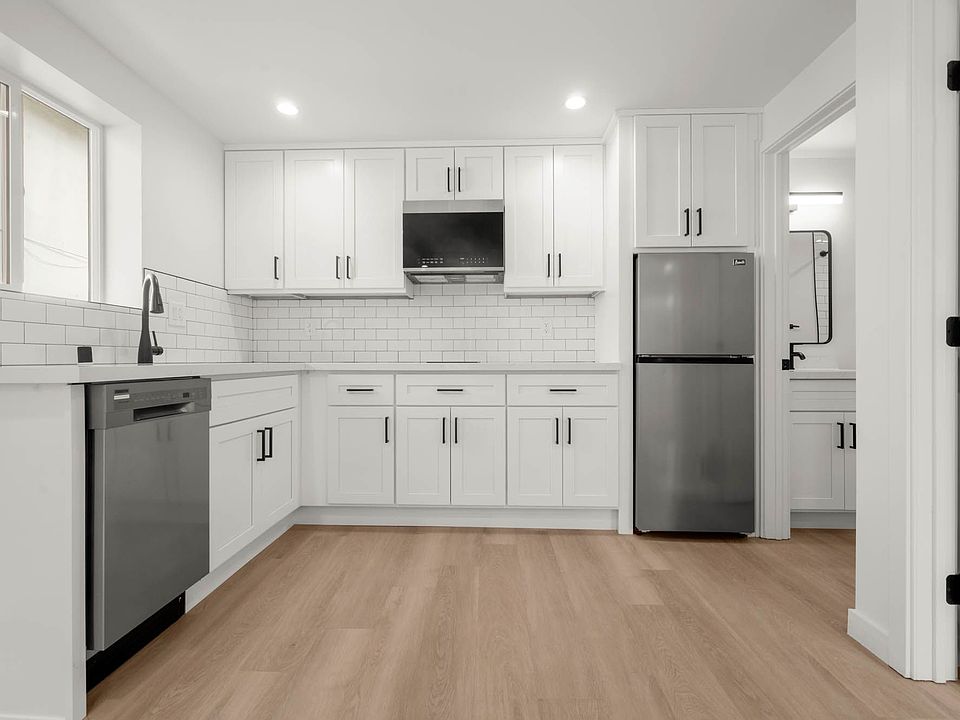 Kitchen - Includes Stainless steel Diswasher, Refrigerator, Stove, and Microwave.