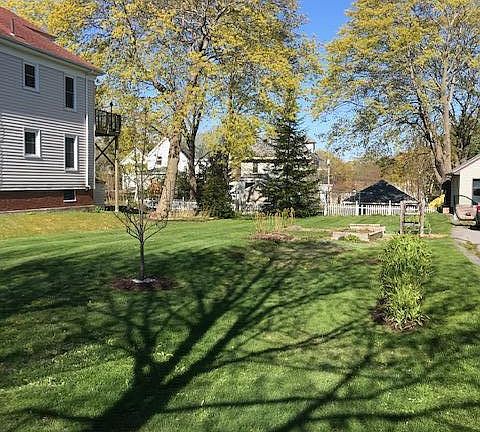 Street view adjoining landscaped lot SW