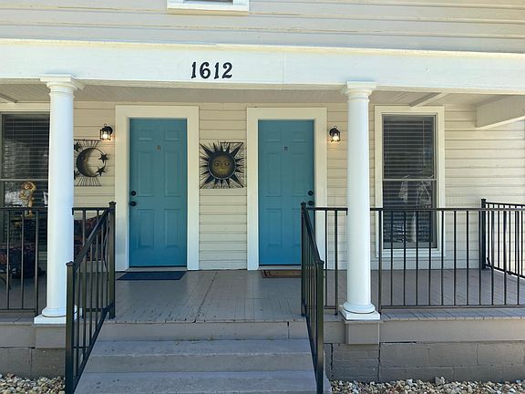 Adorable southern-style front porch with new powder coated aluminum railing.