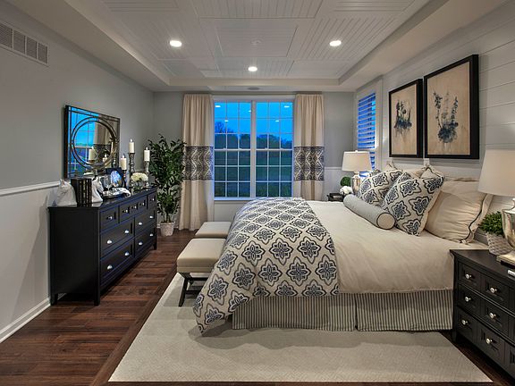 First-floor primary bedroom with two walk-in closets