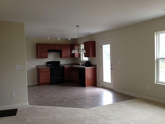 Kitchen and Eat In Kitchen Area With Door To Patio