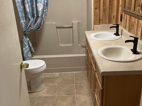 Bathroom paneled walls double vanity linen closet