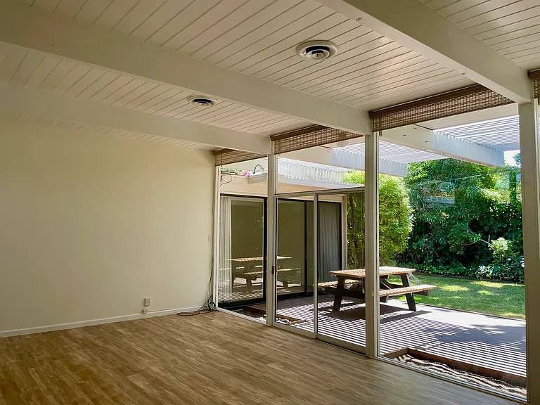 Photo taken from the living room towards the back yard, includes new hardwood flooring