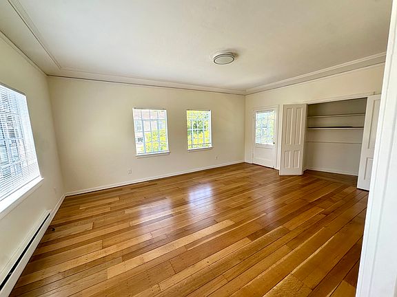 Living room - balcony is off of this room where the door is next to the open closet