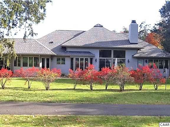 Rear elevation of home- multiple windows to let the enormous views in 	
