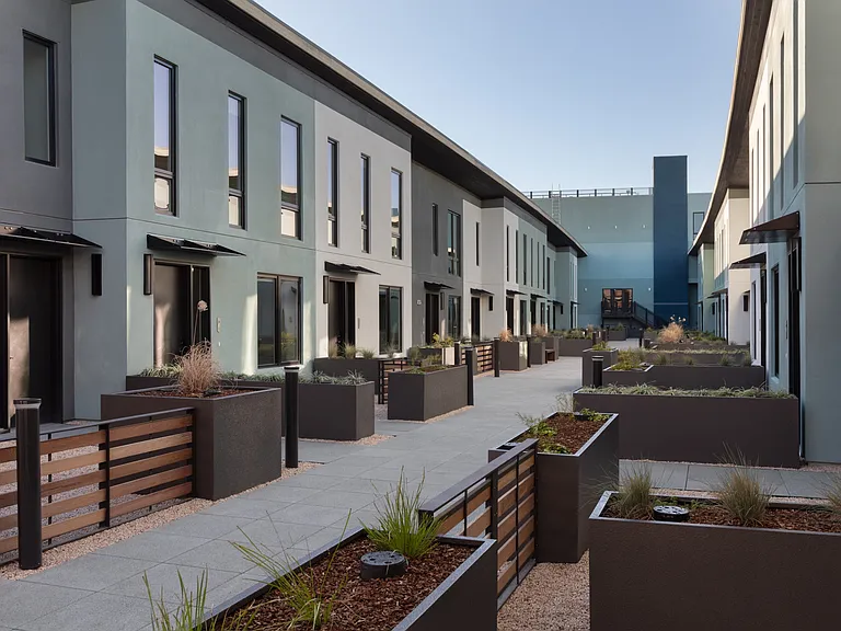 Paseos with landscaped gardens at Star Harbor Apartments & Townhomes in Alameda, CA.