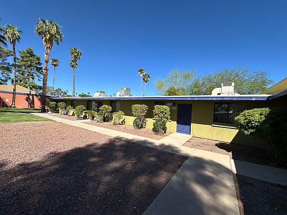 Front entrance with well kept landscaping and friendly neighbors.