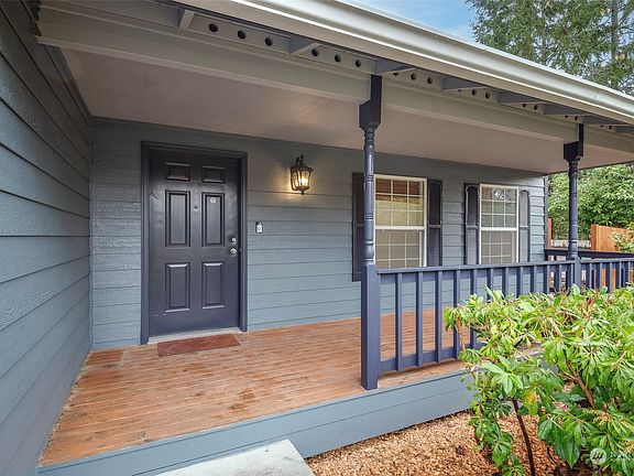 Charming front porch with plenty of space for an oversized swing or patio set. >