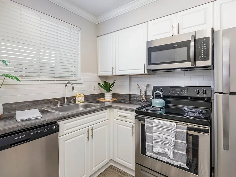 Indulge in culinary enchantment with our kitchens, adorned with top-of-the-line stainless-steel appliances and exquisite finishes.