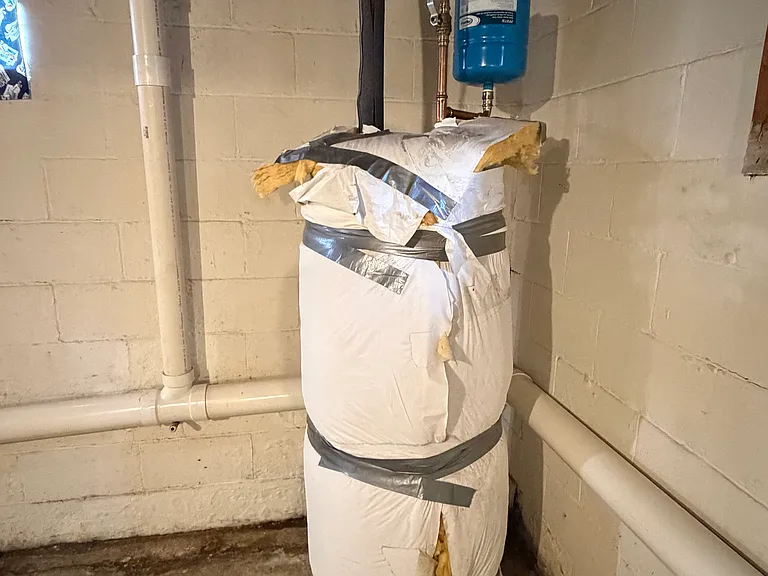 Newer water heater in basement.