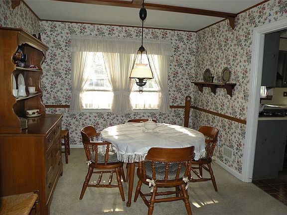Dining Room w/Beamed Ceiling & Hardwood under w/w Carpet