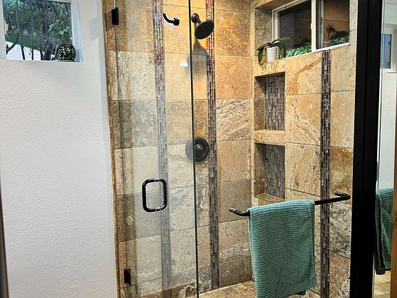central bathroom glass and tiled shower