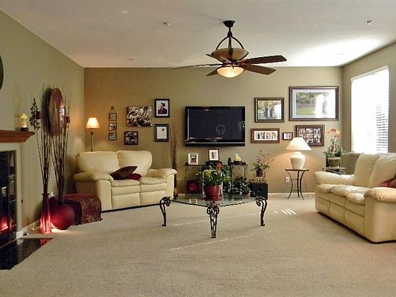 The Family room boasts a fireplace and large windows with beautiful views of the back yard.
