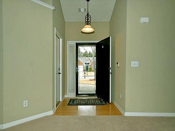 Spacious entry way with hardwoods