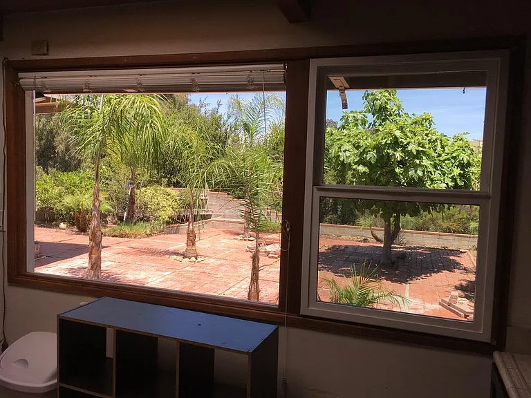 View from kitchen of backyard & canyon