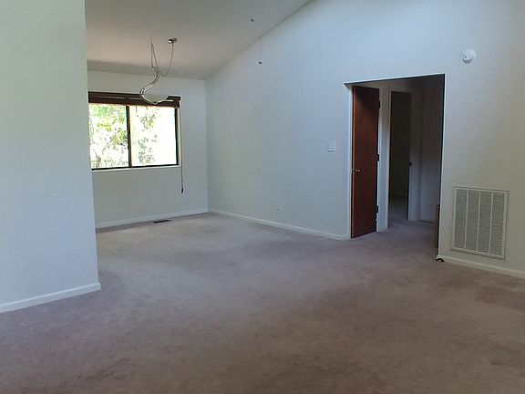 Living room, dining nook + hallway to bathroom and bedrooms 2+3