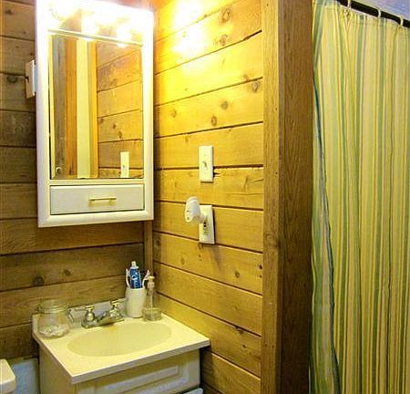 bathroom (shower & storage shelving to right)