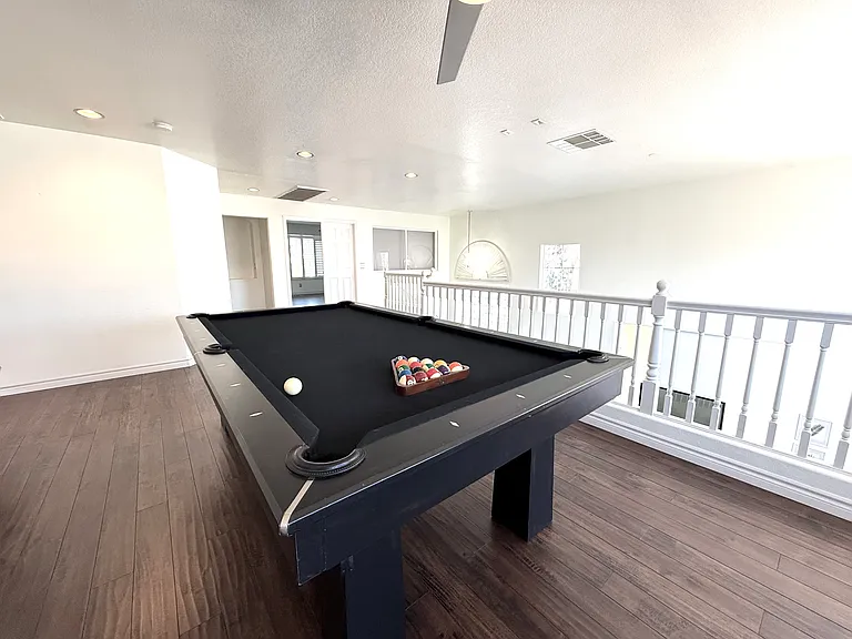 upstairs entertainment area with the pool table