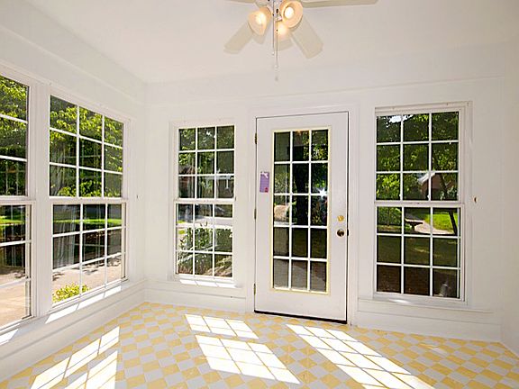 Closed-in, tiled porch