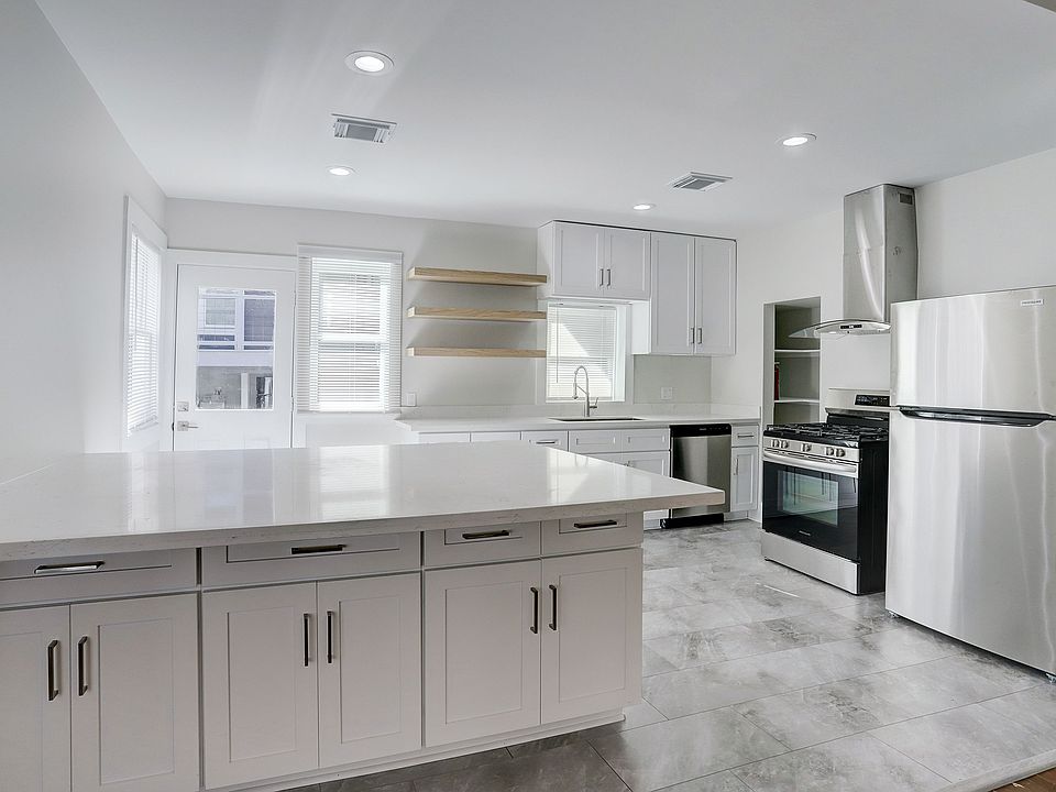 Spacious island counter with lots of cabinets for storage. Perfect for entertaining!