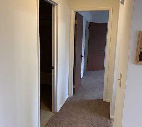 Hallway to bedroom- bathroom is doorway on the left