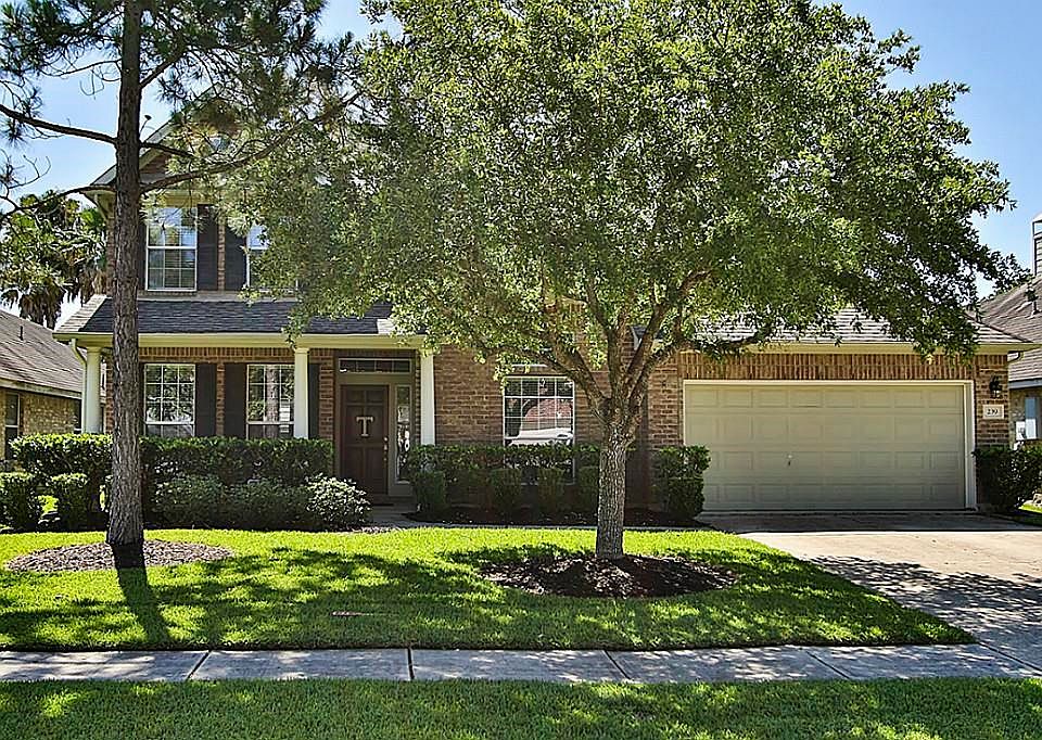 David Weekley Home On Treed Line Street.