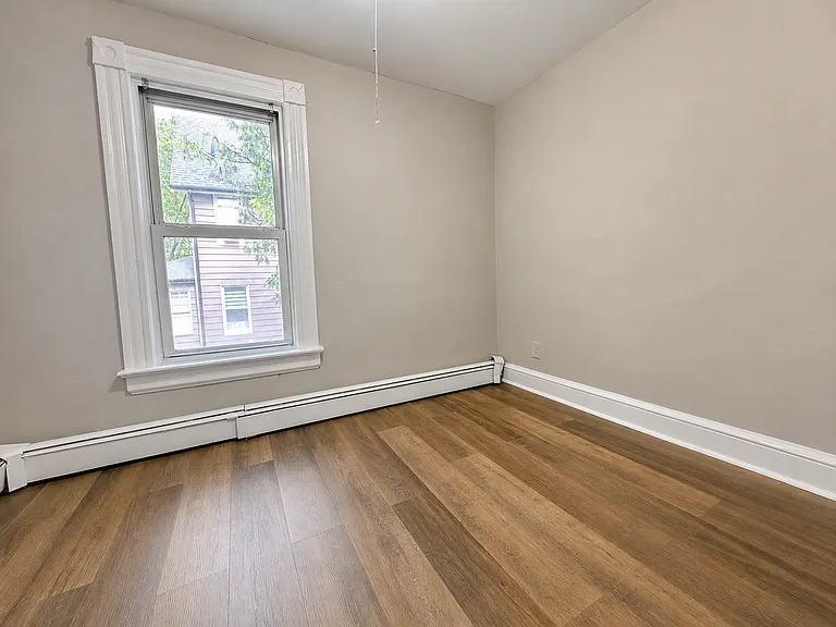 Compact third bedroom, perfect as a child's room, nursery, guest room, or home office.