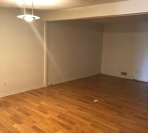 Hardwood floors in living room and dining area