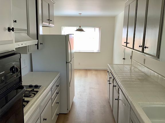 Kitchen view from the front entrance. New LVP flooring.
