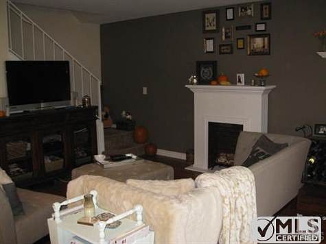 Living room area (the faux fireplace is the tenants' persona