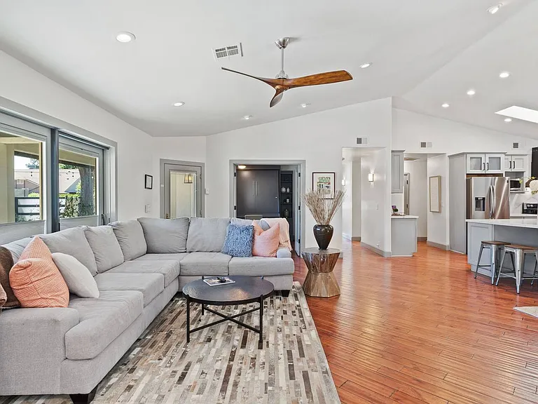 Family Room - Front door is glass with retractable screen door.
Den/Office is to the right of front door.
Sliding glass doors to outside patio, by pool behind the couch.
High Valted ceiling throughout the kitchen/family great room