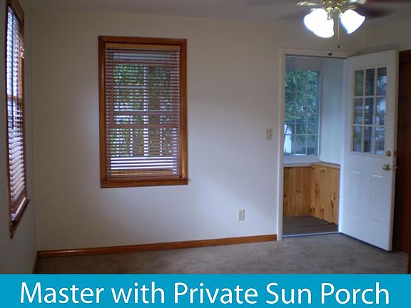 Bedroom 1 has private 3 season porch with bead board, lighti