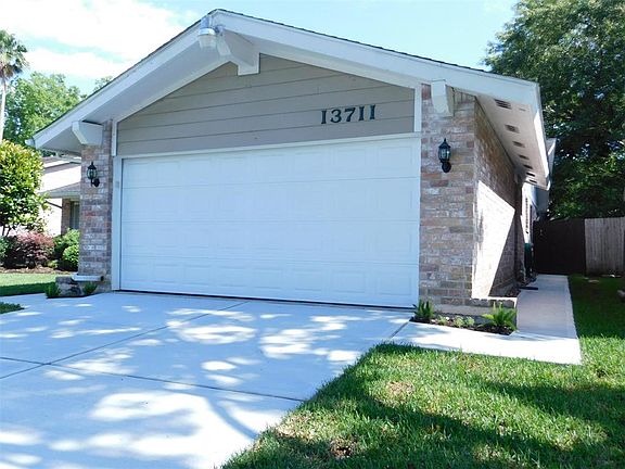 Another view of the recent driveway and the right side recent walkway to the rear.