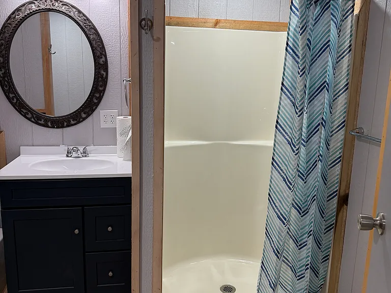 Master Bathroom with 42 inch shower, tube, 36 inch vanity with lots of plugs.